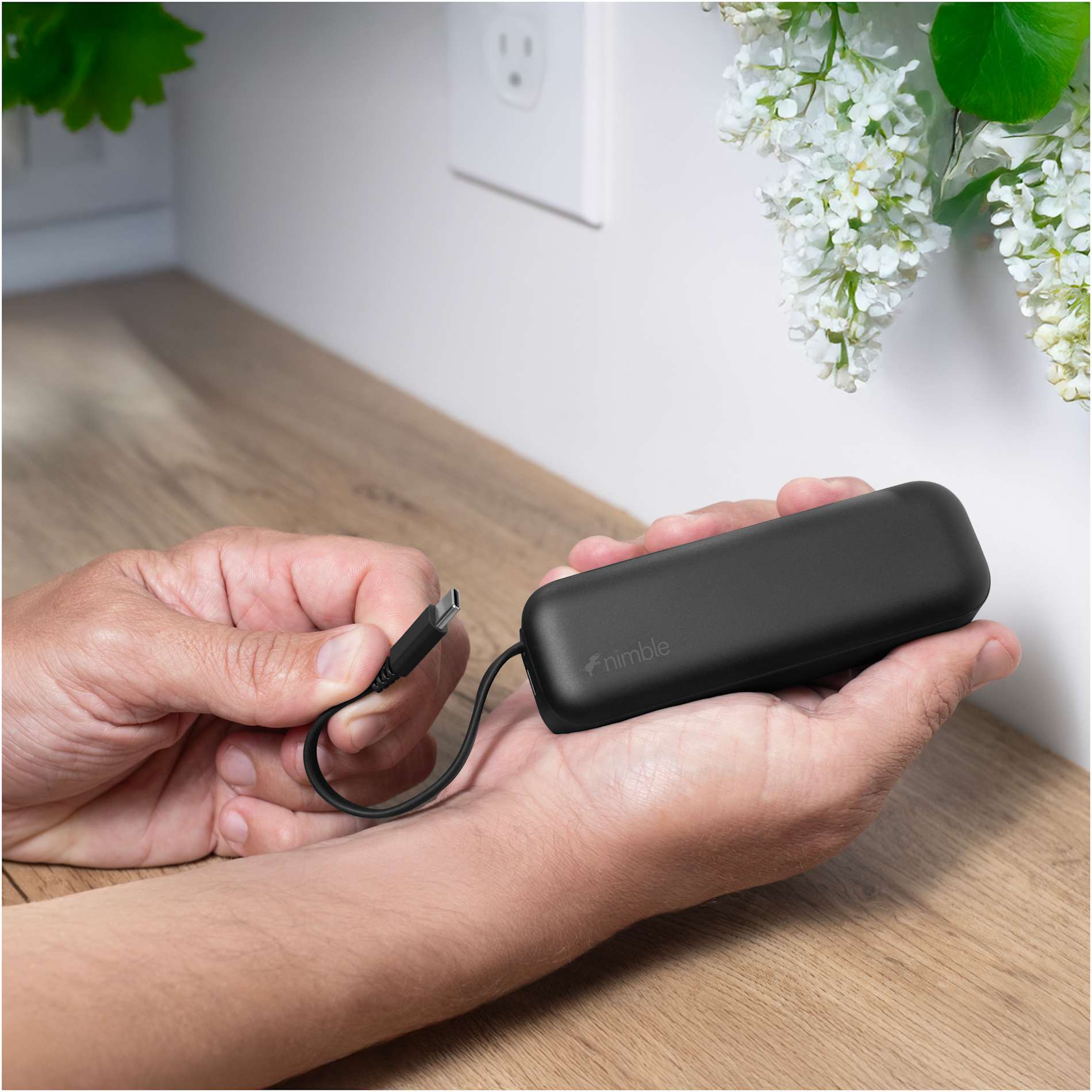 Front View of Black Wally Pro 20 5000 mAh Powerbank and Wall Charger